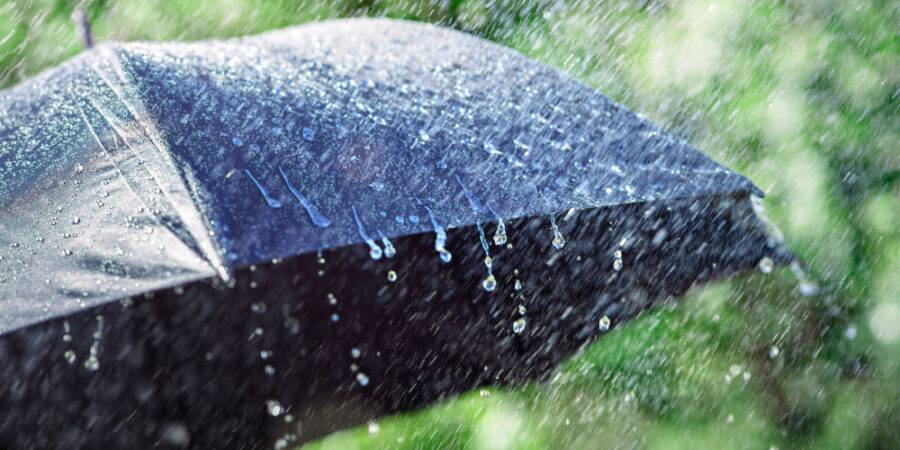 Rain on umbrella background, weather forecast and environmental concept